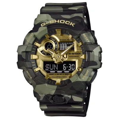 Angled view of the G-SHOCK GA700CMG-3A with a green camo case, gold dial, and analog-digital display.
