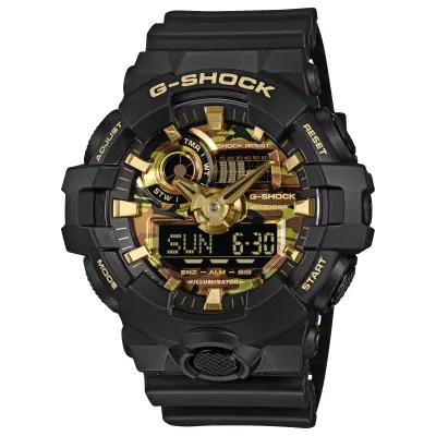 Angled close-up of the G-SHOCK GA700CF-1A with a black resin case, camouflage dial, and gold accents.