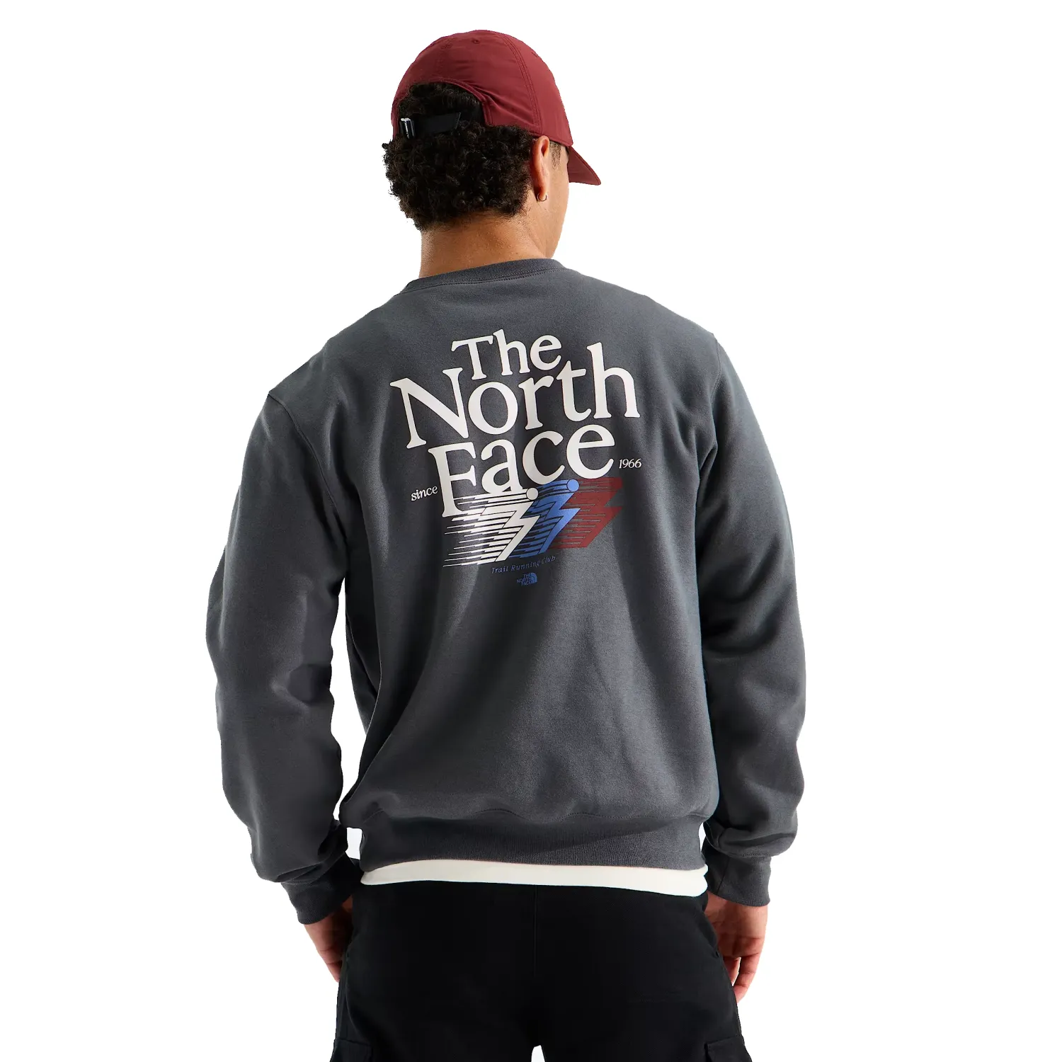 Back view of The North Face anthracite crewneck with a large white, blue and red retro trail graphic.