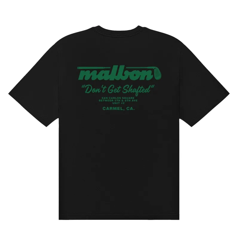 Back product view of the black Malbon Vista Repair Tee with green golf club branding and repair shop text.