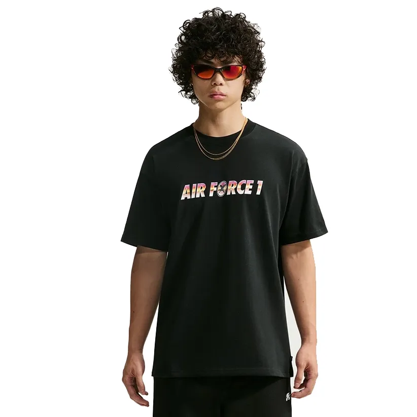 Front view of a model wearing the black Nike SB x Yuto tee with a multicolor Air Force 1 chest graphic.