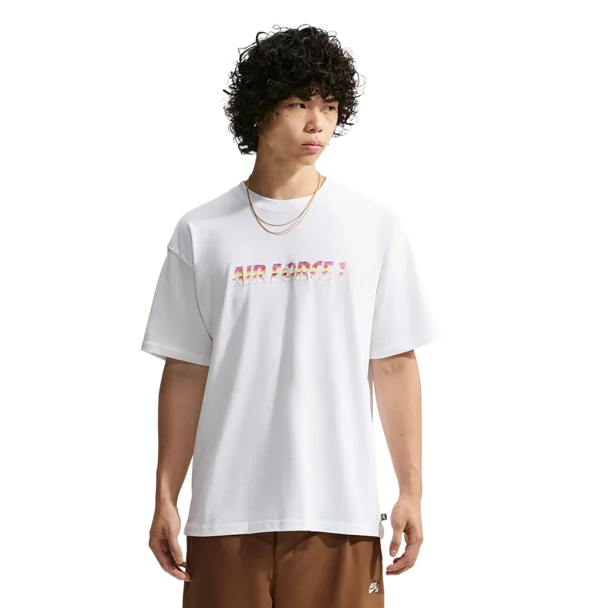 Front view of a model wearing the white Nike SB x Yuto tee with a multicolor Air Force 1 chest graphic.
