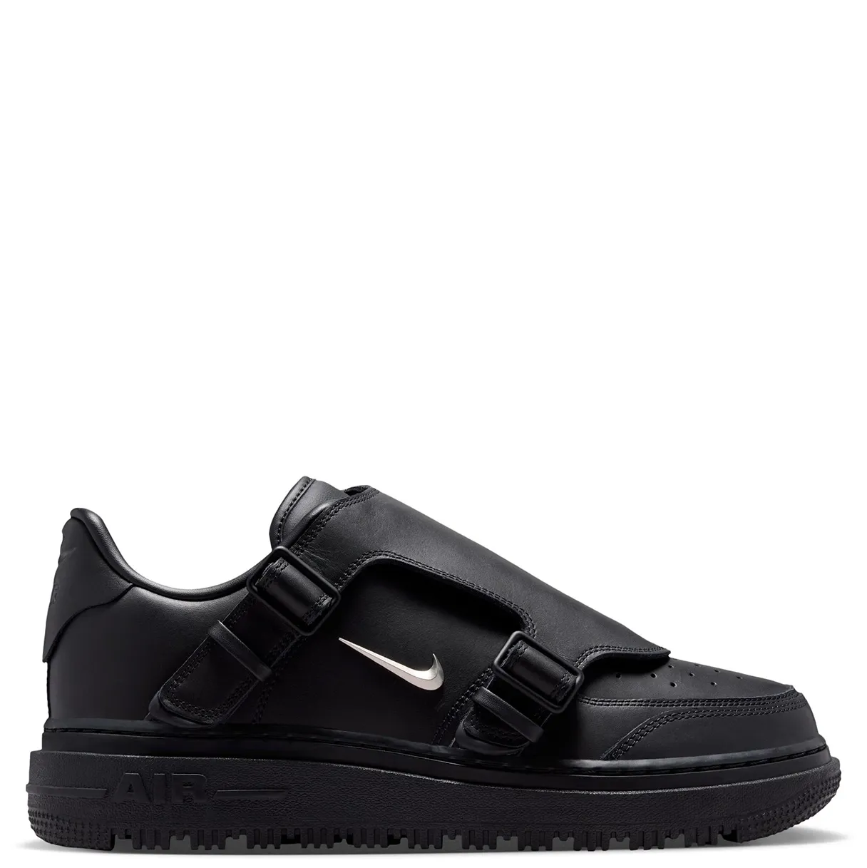 Medial view of Nike Air Force 1 LX with buckle straps and metallic silver Swoosh