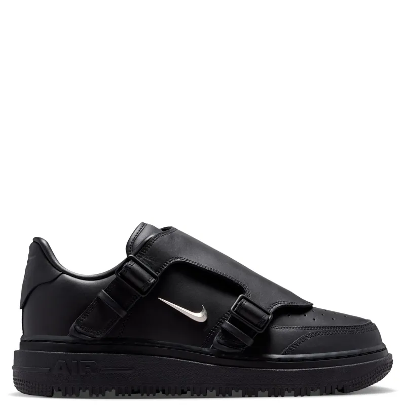 Medial view of Nike Air Force 1 LX with buckle straps and metallic silver Swoosh