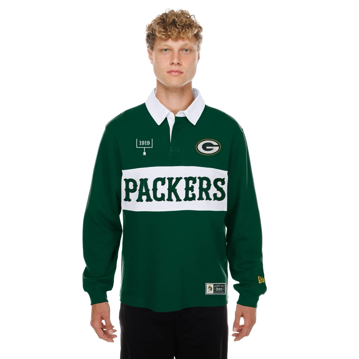 Front view of green New Era Packers rugby shirt with a white collar, chest stripe, team lettering and logo graphics.