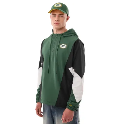 Angled front view of model wearing the green New Era Packers quarter-zip windbreaker with color-blocked sleeves.