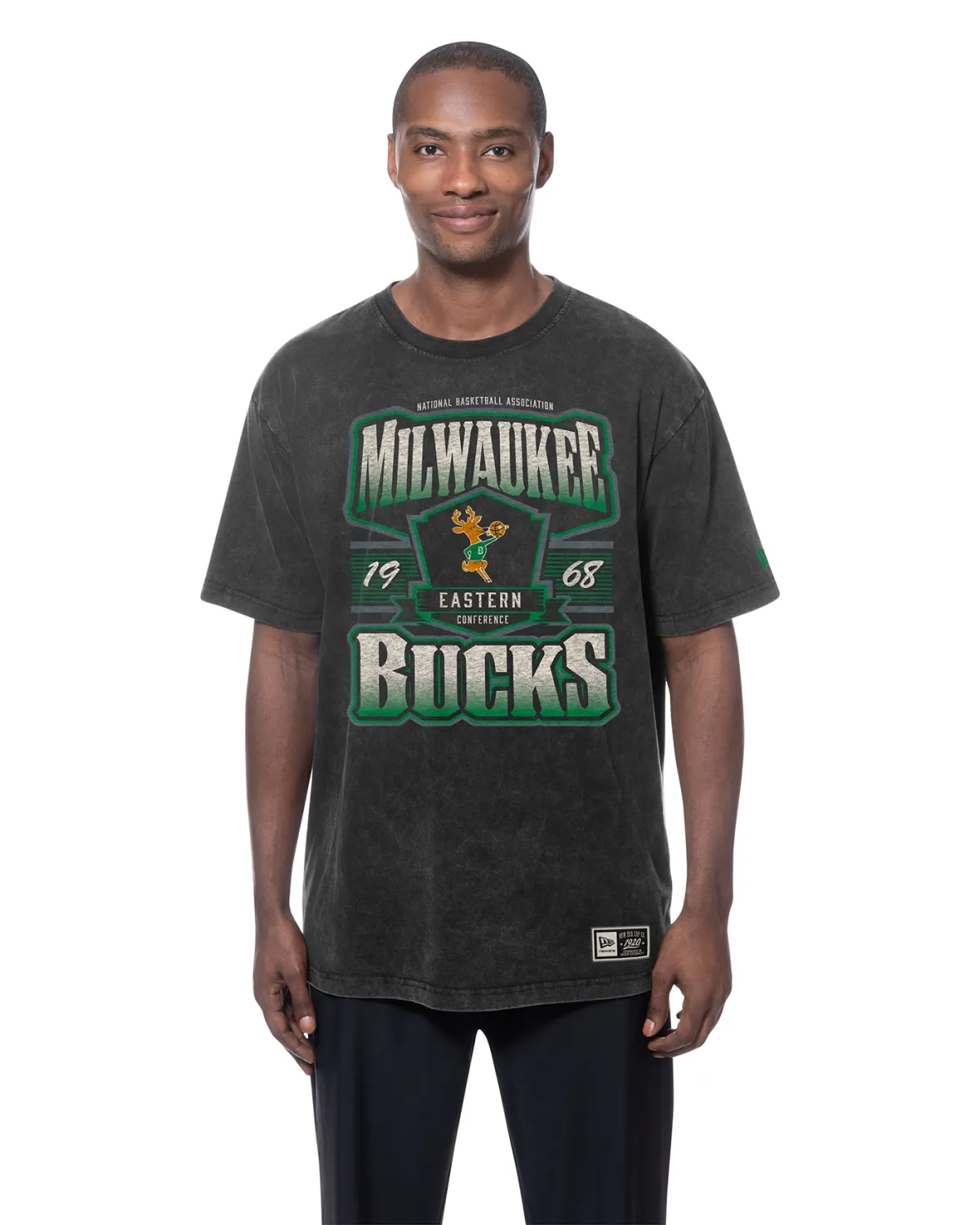 Model wearing black New Era Milwaukee Bucks Bango Mineral Wash Tee with oversized vintage front graphic