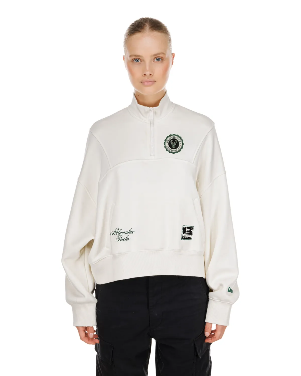 Front view of New Era Milwaukee Bucks women's Crest quarter-zip top in Dune with embroidered team details