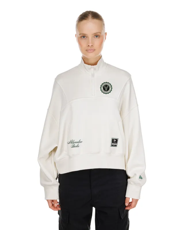 Front view of New Era Milwaukee Bucks women's Crest quarter-zip top in Dune with embroidered team details