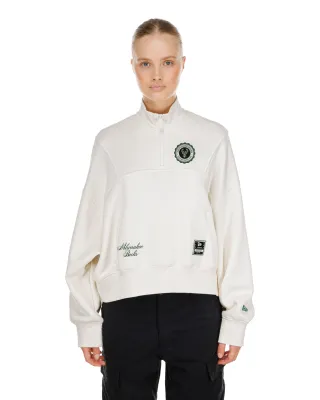 Front view of New Era Milwaukee Bucks women's Crest quarter-zip top in Dune with embroidered team details