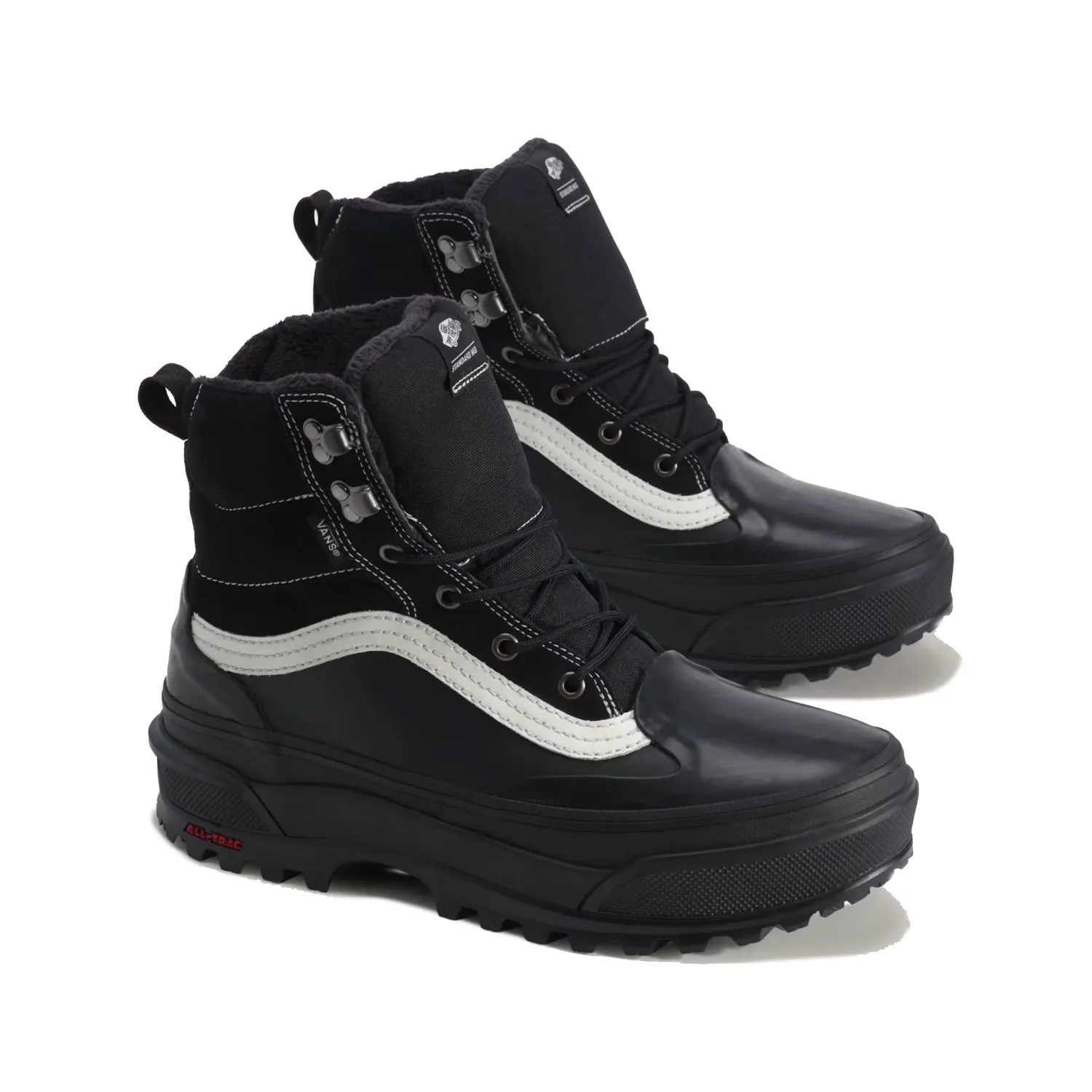Three-quarter view of Vans Standard Mid 2.0 boots with black uppers, white Sidestripes and warm lining