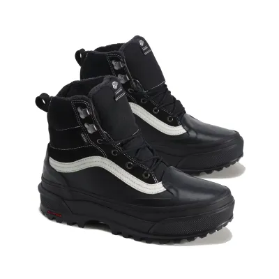 Three-quarter view of Vans Standard Mid 2.0 boots with black uppers, white Sidestripes and warm lining