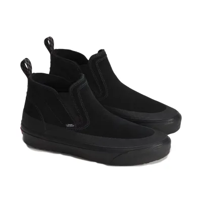 Three-quarter view of black Vans Mid-Slip Insulated shoes with mid-top suede uppers and checkerboard heel pulls