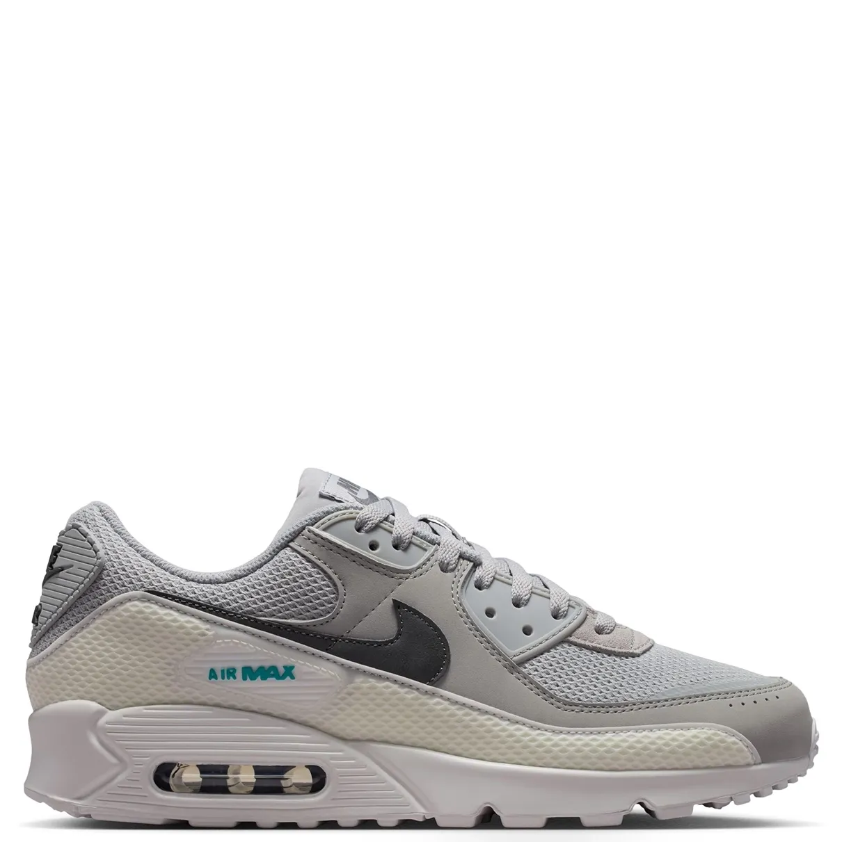 Medial side view of the Air Max 90 Premium showing grey overlays, dark Swoosh branding and visible Air cushioning.