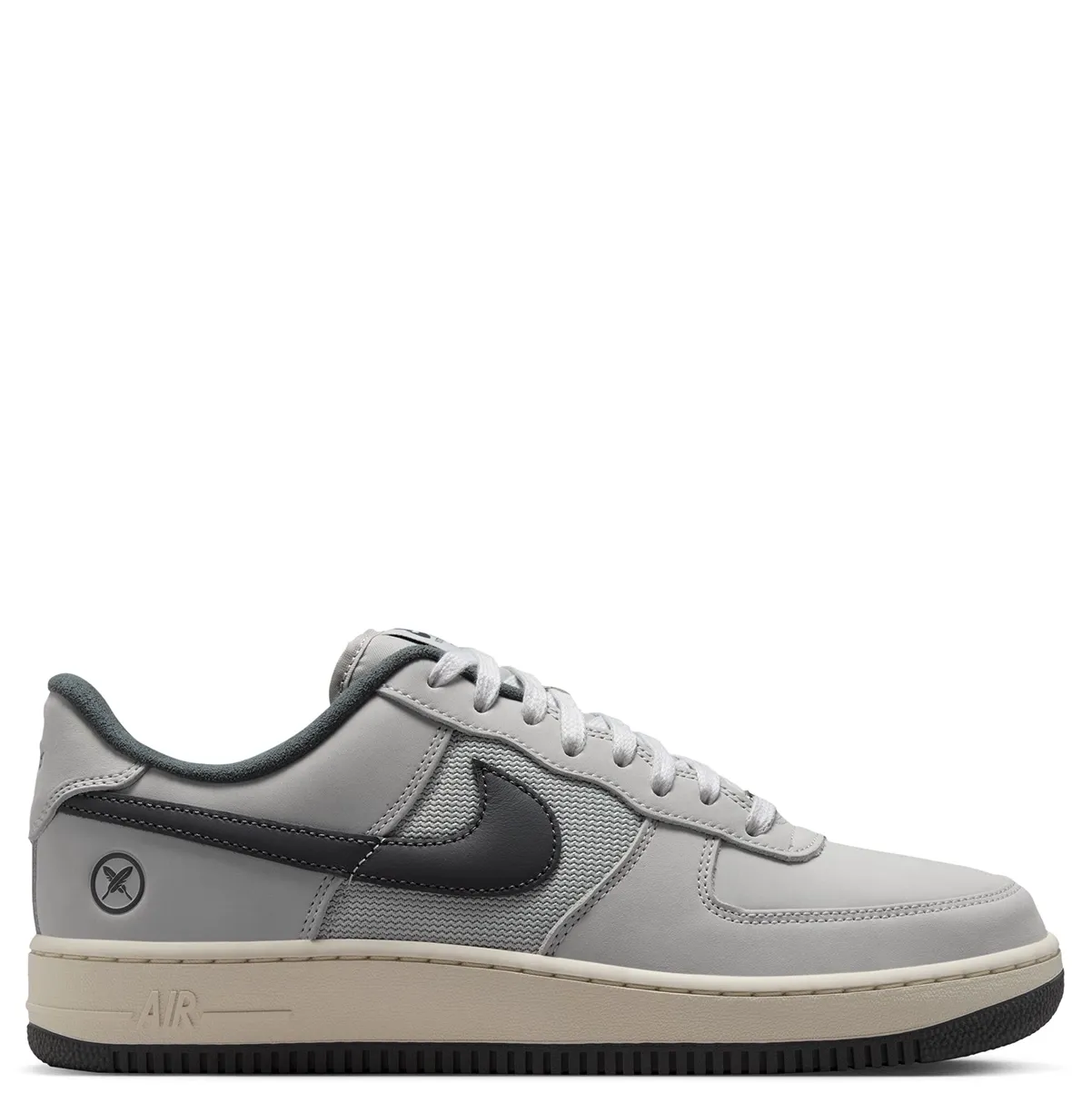 Opposite side view of the Nike SB x Yuto Air Force 1 with cross-feather crest and Air branding.