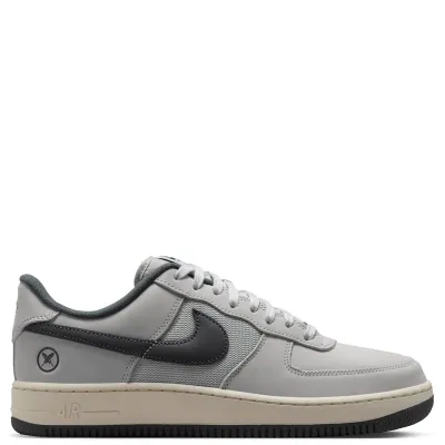 Opposite side view of the Nike SB x Yuto Air Force 1 with cross-feather crest and Air branding.