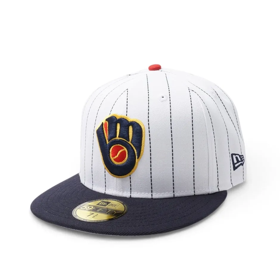Angled front view of white pinstripe Brewers 59FIFTY hat with Ball &amp; Glove logo and navy bill