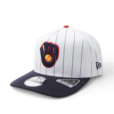 Angled front view of white pinstripe Brewers A-Frame snapback with Ball &amp; Glove logo and navy bill