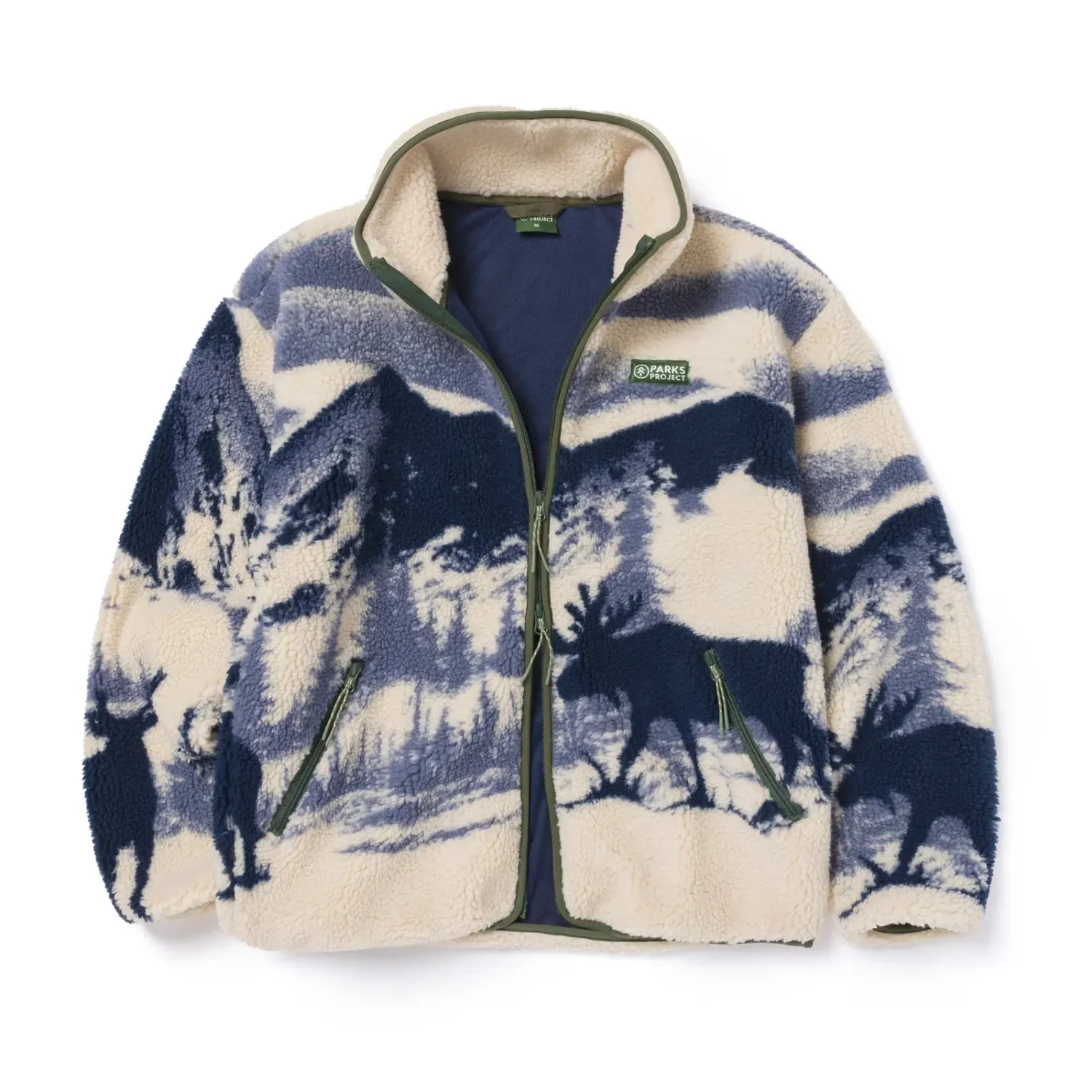 Front product view of the Natural/Navy Acadia Moose fleece with mountain artwork and green zipper trim.