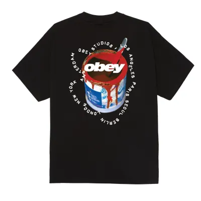 Back view of the black Obey Real Spill tee showing a colorful paint-can graphic and Obey logo