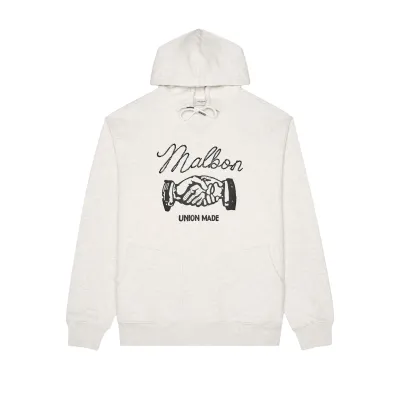 Front view of the Malbon Golf Union Made hoodie showing the black Malbon and handshake graphic