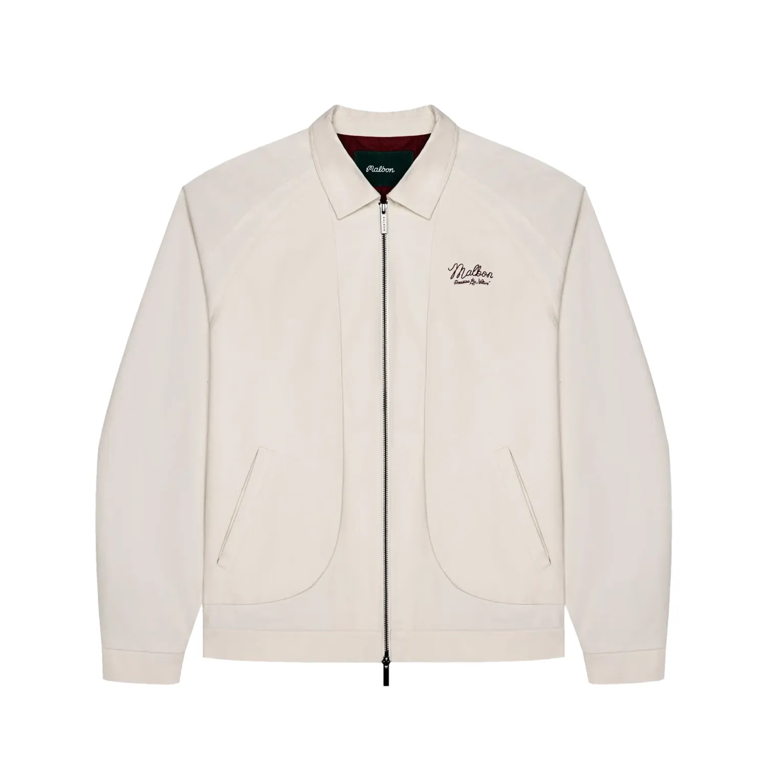 Front view of the ivory Malbon Golf Field jacket showing its zipper, welt pockets and chest embroidery