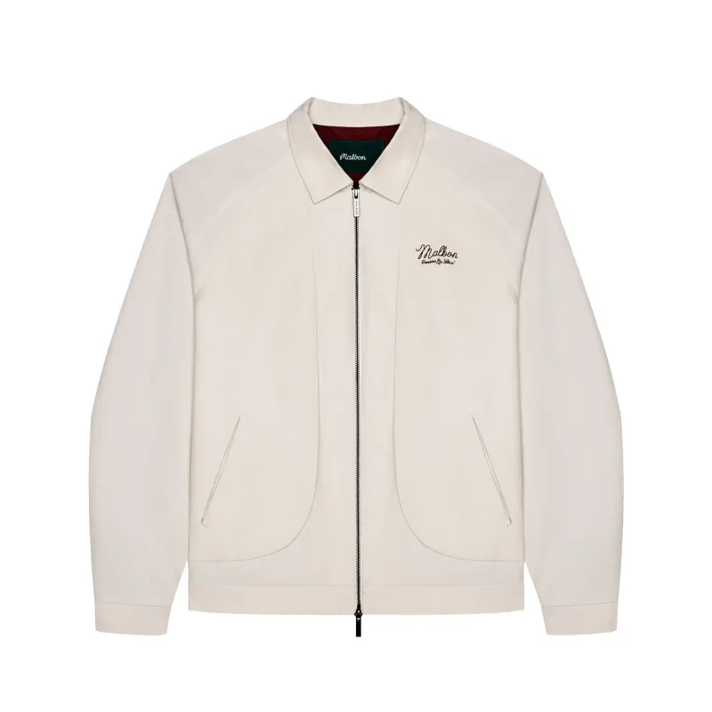 Front view of the ivory Malbon Golf Field jacket showing its zipper, welt pockets and chest embroidery