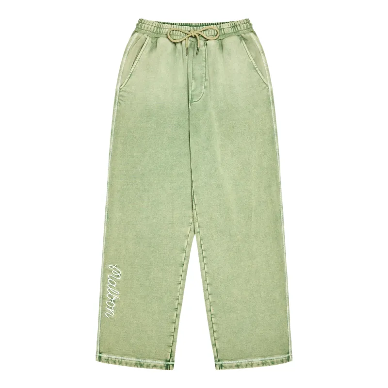 Front view of the Malbon Fragment sweatpants showing the straight legs and lower-leg artwork