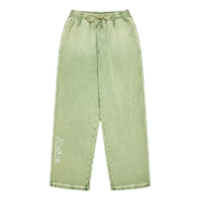 Front view of the Malbon Fragment sweatpants showing the straight legs and lower-leg artwork