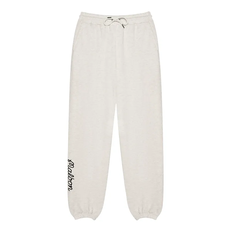 Front view of the Malbon Clubhouse sweatpants showing the drawcord and lower-leg script