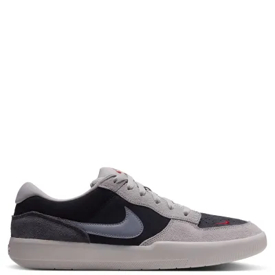 Opposite side view of the Nike SB Force 58 with a red toe Swoosh and layered suede upper.