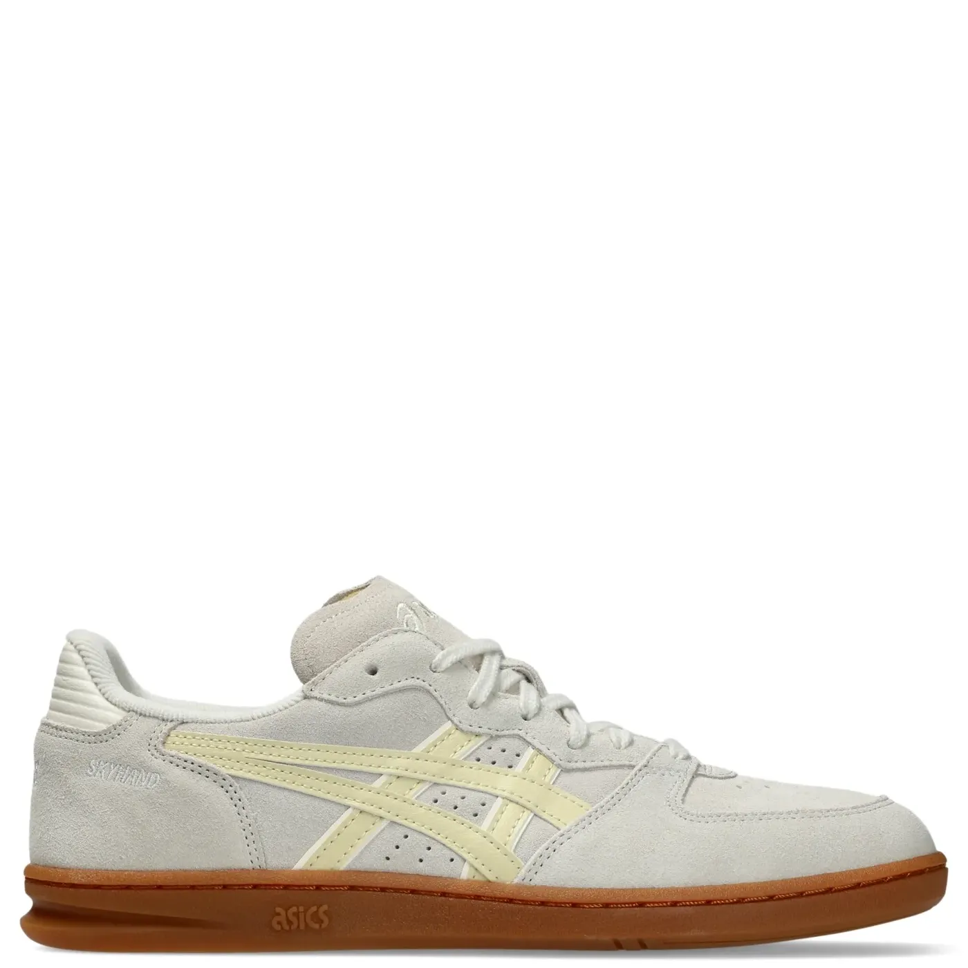 Inner side view of the cream suede ASICS SKYHAND OG with pale yellow stripes and SKYHAND embroidery.