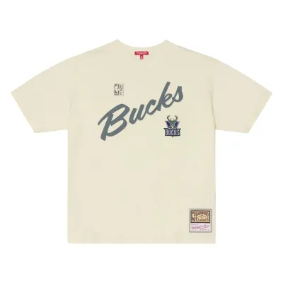 Front view of the women’s cream Bucks oversized tee with script graphic, embroidered logo and woven jock tag.