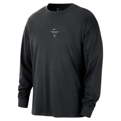 Front view of the black Nike Bucks long sleeve top with small team graphics at the center chest.