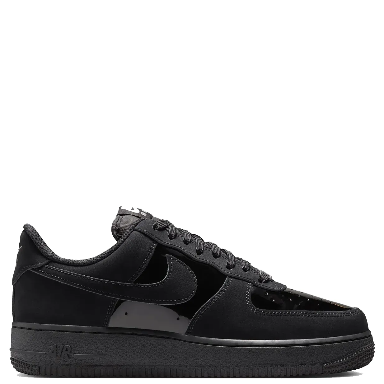 Side profile of the black Nike Women’s Air Force 1 ’07 SE showing glossy panels, a tonal Swoosh and black sole.