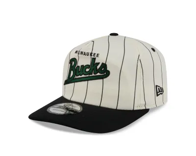 Angled front view of the cream Bucks Pinstripe 19TWENTY Hat with green script embroidery and a black visor.