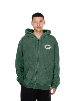 Front view of a model wearing the stone-washed green New Era Packers full-zip hoodie