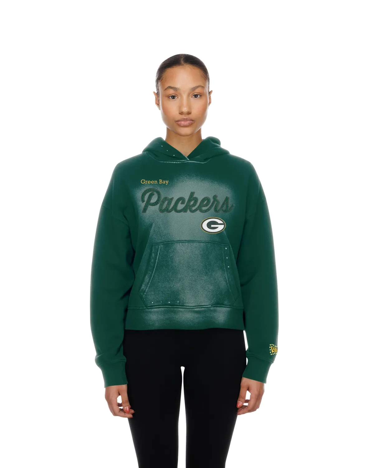 Front view of a model wearing the green New Era Packers Fade hoodie with script and team logo