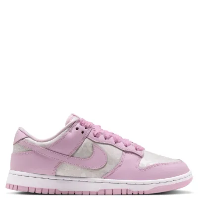Opposite side view of the Nike Women's Dunk Low SE showing Pink Foam overlays and a white midsole.