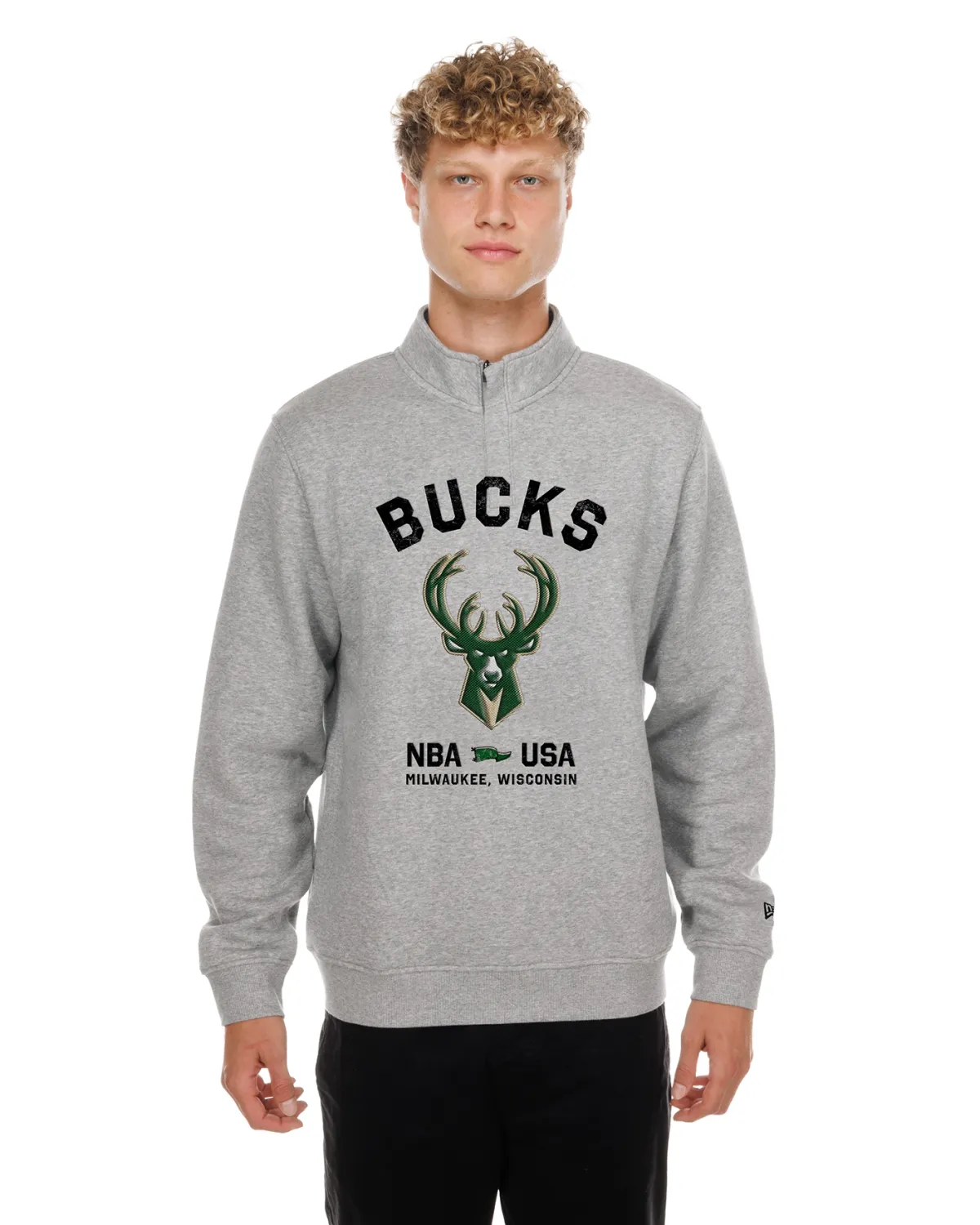 Front view of a model wearing the Heather Grey New Era Bucks Primary 1/4 Zip Sweatshirt with team graphics.