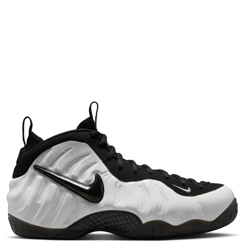Outer side view of Nike Air Foamposite Pro Premium Glow with a glossy black Swoosh on the molded white upper.