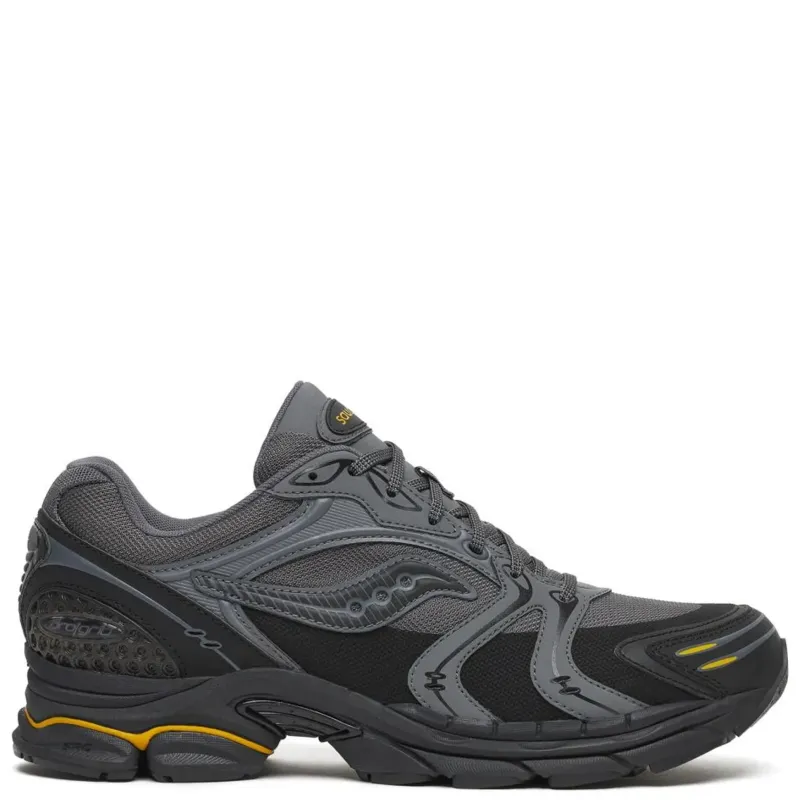 Outer side view of the Saucony ProGrid Triumph 4 in Carbon/Black with layered grey overlays and yellow accents.