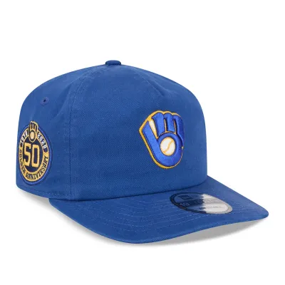 Opposite angled view of the royal Brewers 19TWENTY Hat showing the front logo and 50th anniversary side patch.