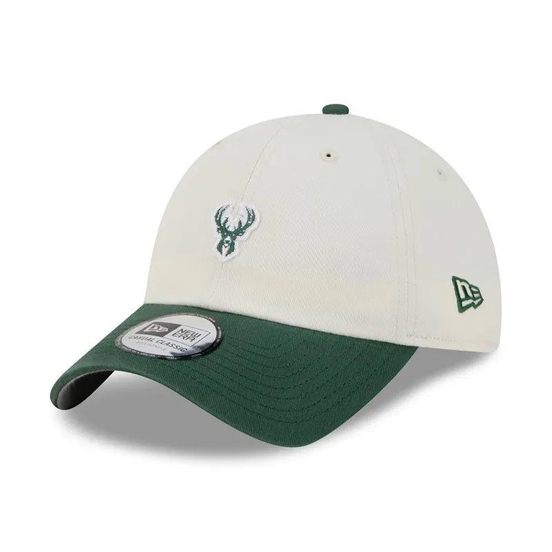 Front left angled view of cream Bucks Micro Logo Casual Classic hat with a green visor and New Era flag.