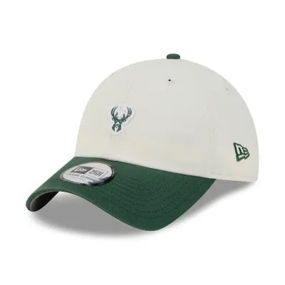 Front left angled view of cream Bucks Micro Logo Casual Classic hat with a green visor and New Era flag.