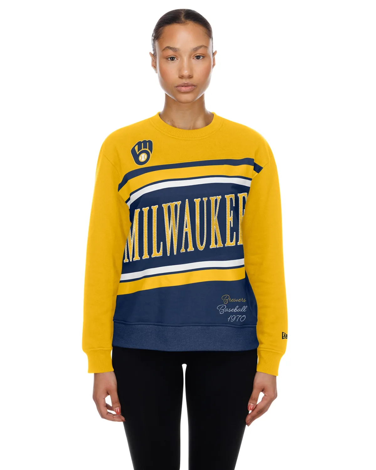 Model wearing the gold Brewers Women’s Banner Crewneck with Milwaukee lettering and a ball-in-glove chest logo.