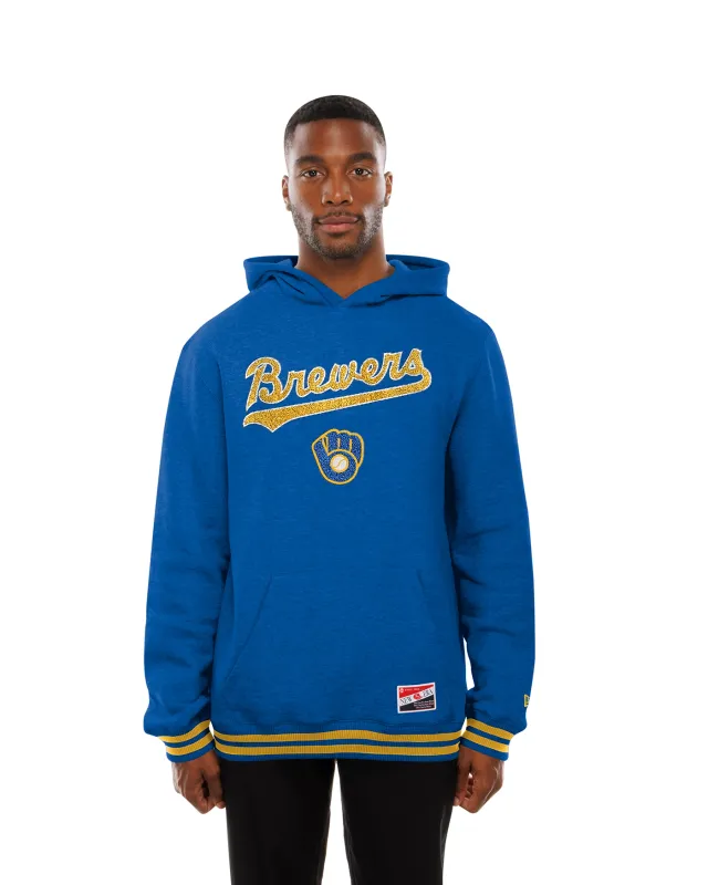 Front view of blue New Era Brewers Cooperstown hoodie with chenille script, ball-in-glove logo and gold-striped trim.