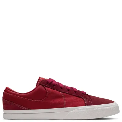 Opposite side view of Nike Blazy with red panels, contrast stitching and a Sail sole.