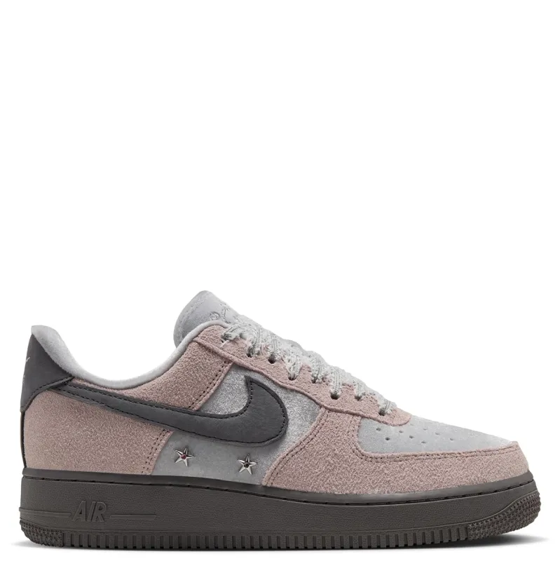 Opposite side view of Nike women's Air Force 1 '07 showing pink overlays, silver panels and a dark sole.