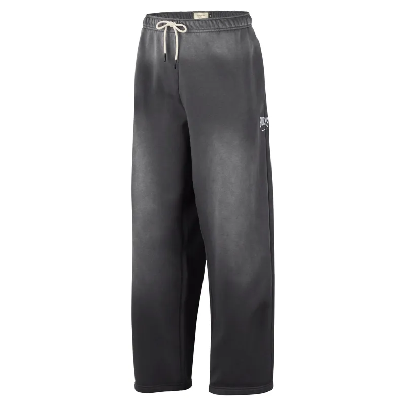 Front view of charcoal Nike Bucks Standard Issue pants with a cream drawcord, Bucks lettering and Nike Swoosh.